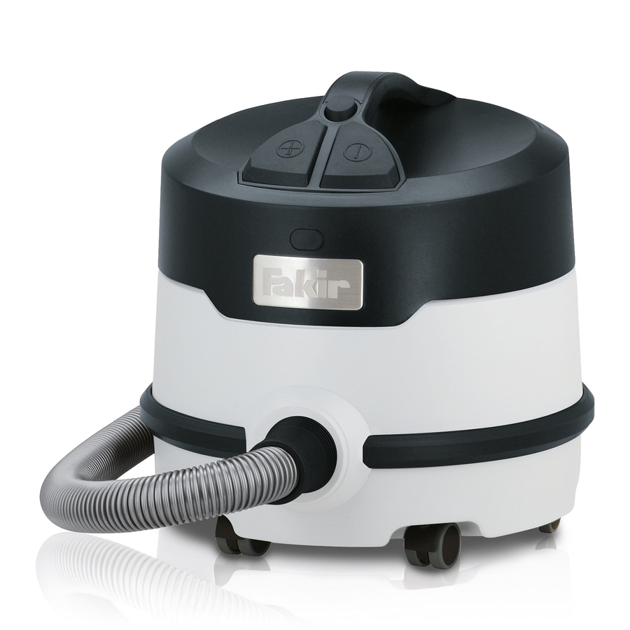 Ein weißer und schwarzer Fakir Staubsauger mit Schlauch und Rädern.