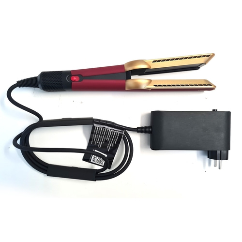 Ein rotes und goldenes Glätteisen mit schwarzem Kabel und Stecker