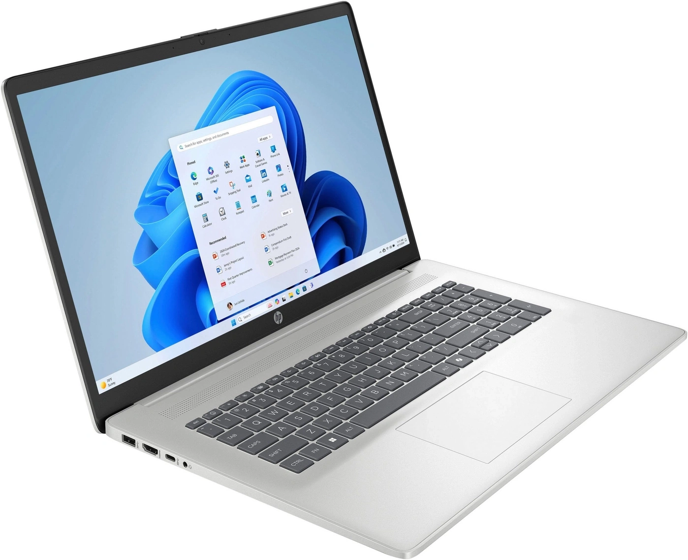 Ein offenes silbernes HP Laptop mit Windows 11 auf dem Bildschirm.