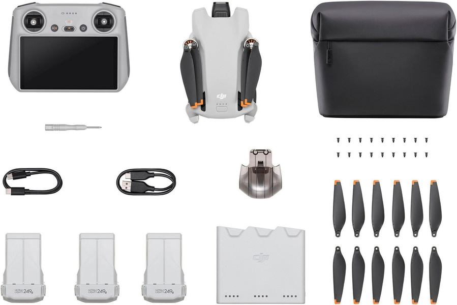 Drohne mit Zubehör: Fernbedienung, Akkus, Propeller, Ladegerät, Tragetasche, Schraubendreher.