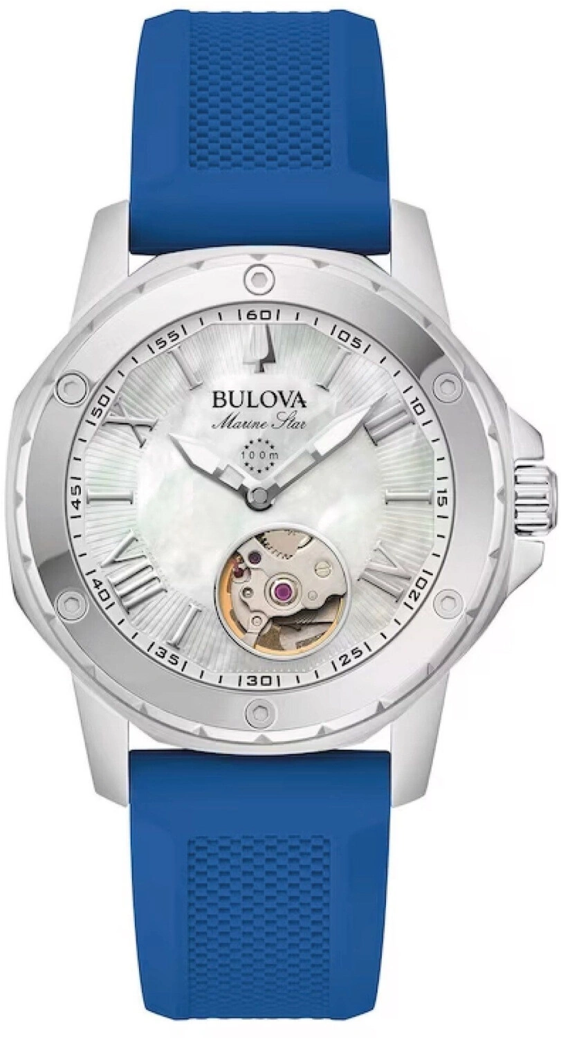 Eine silberne Bulova Marine Star Uhr mit blauem Armband und offenem Herz-Uhrwerk.