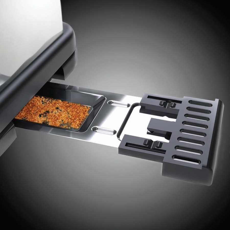 Nahaufnahme eines Toasters mit Krümelschublade und Toastkrümeln
