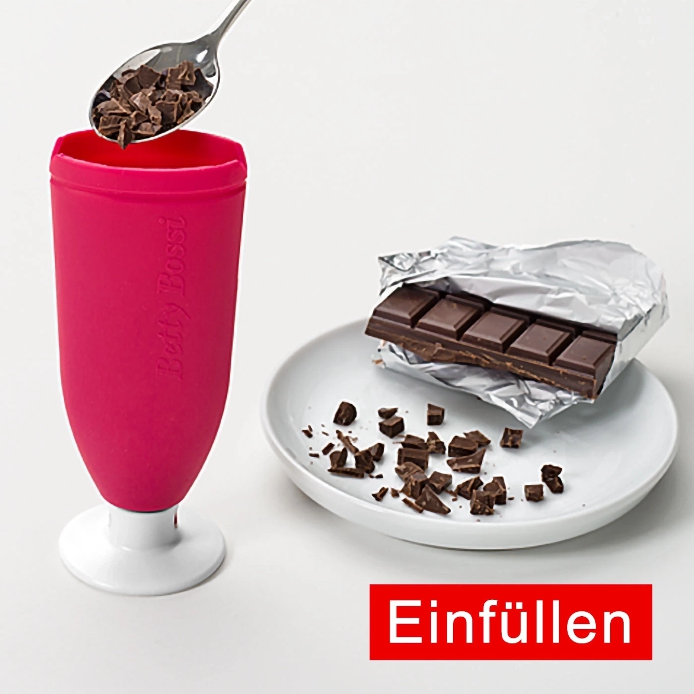 Rosa Becher mit Schokolade und Löffel, Text: Einfüllen