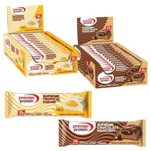 Schokoladen-Haselnuss und tropische Cremeproteinriegel mit Kartons und einzelnen Riegeln.