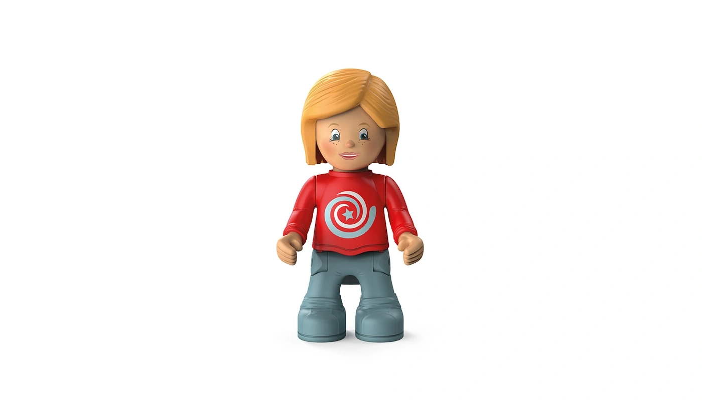 Eine Spielzeugfigur eines Mädchens mit blonden Haaren und einem roten Hemd.