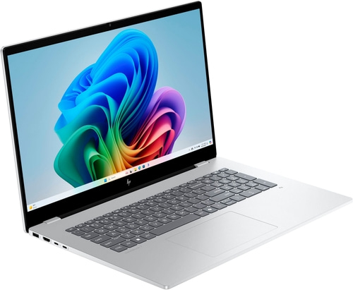 Ein silberner HP Omnibook 7 Laptop mit Windows 11 und einem farbenfrohen Hintergrundbild.