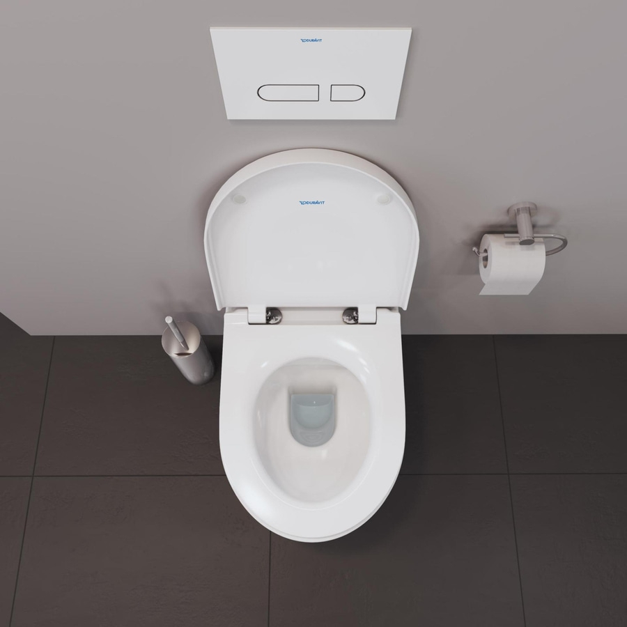 Draufsicht auf eine weiße Toilette mit Toilettensitz und Spülkasten, daneben Toilettenpapierhalter.