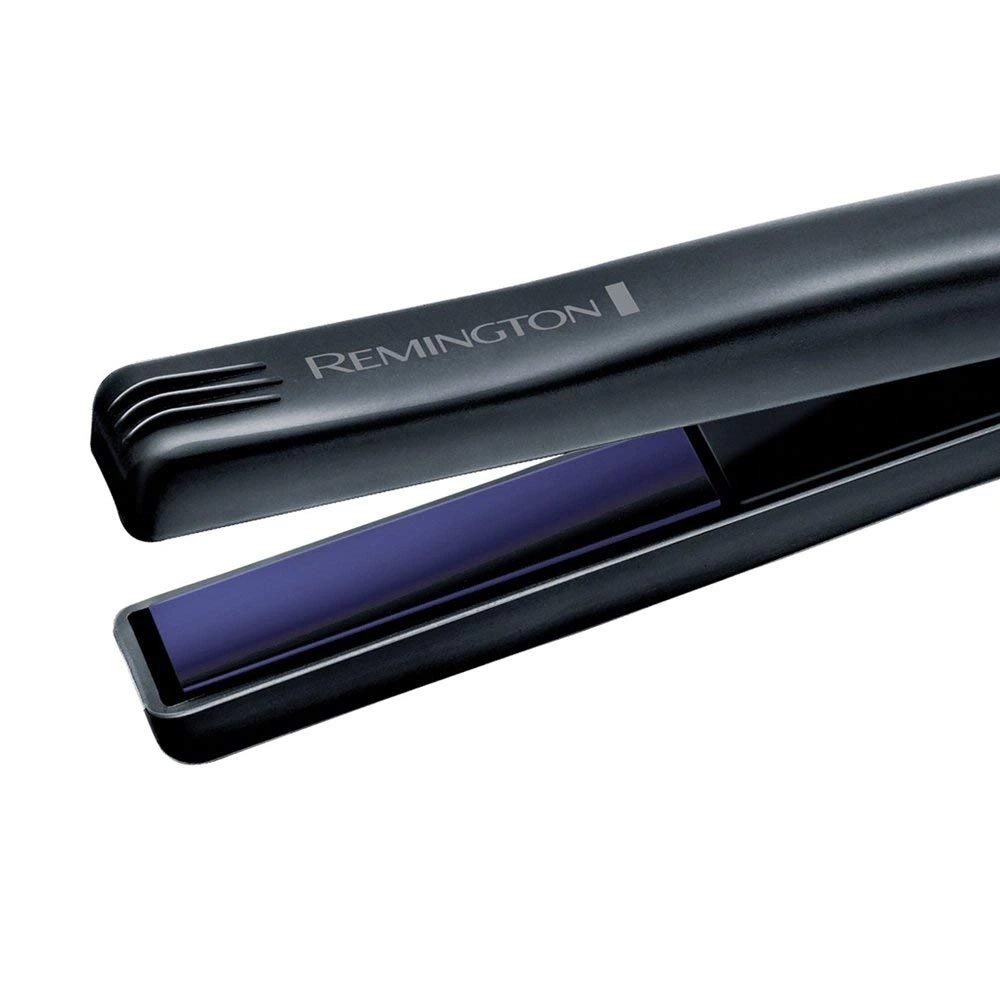 Schwarzes Remington Glätteisen, Nahaufnahme, geöffnet, violette Platten, isoliert
